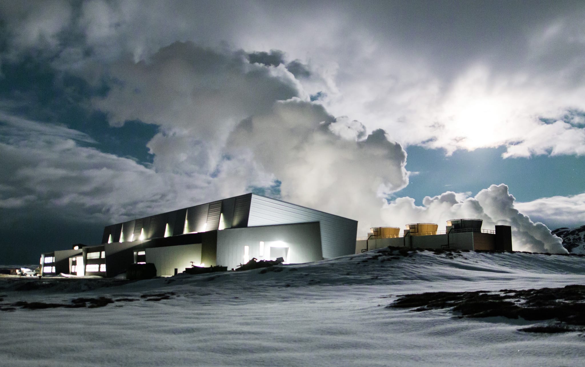 Power plant outside in the snow, clouds in the sky