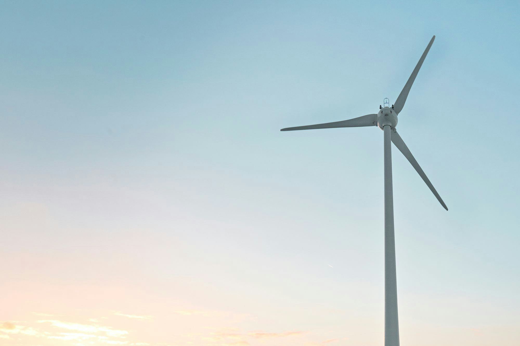 a wind power under blue sky